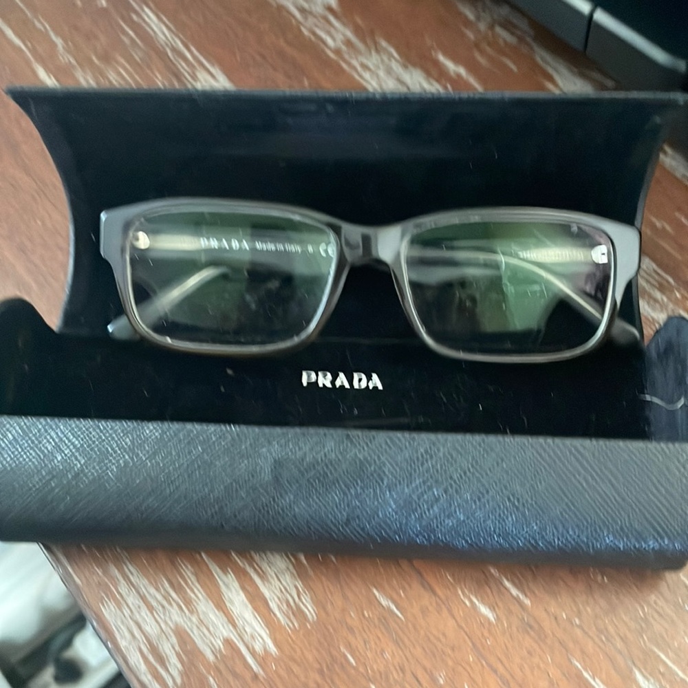 Prada VPR 16M OAQ-101 Wood eyeglasses with black logo case.